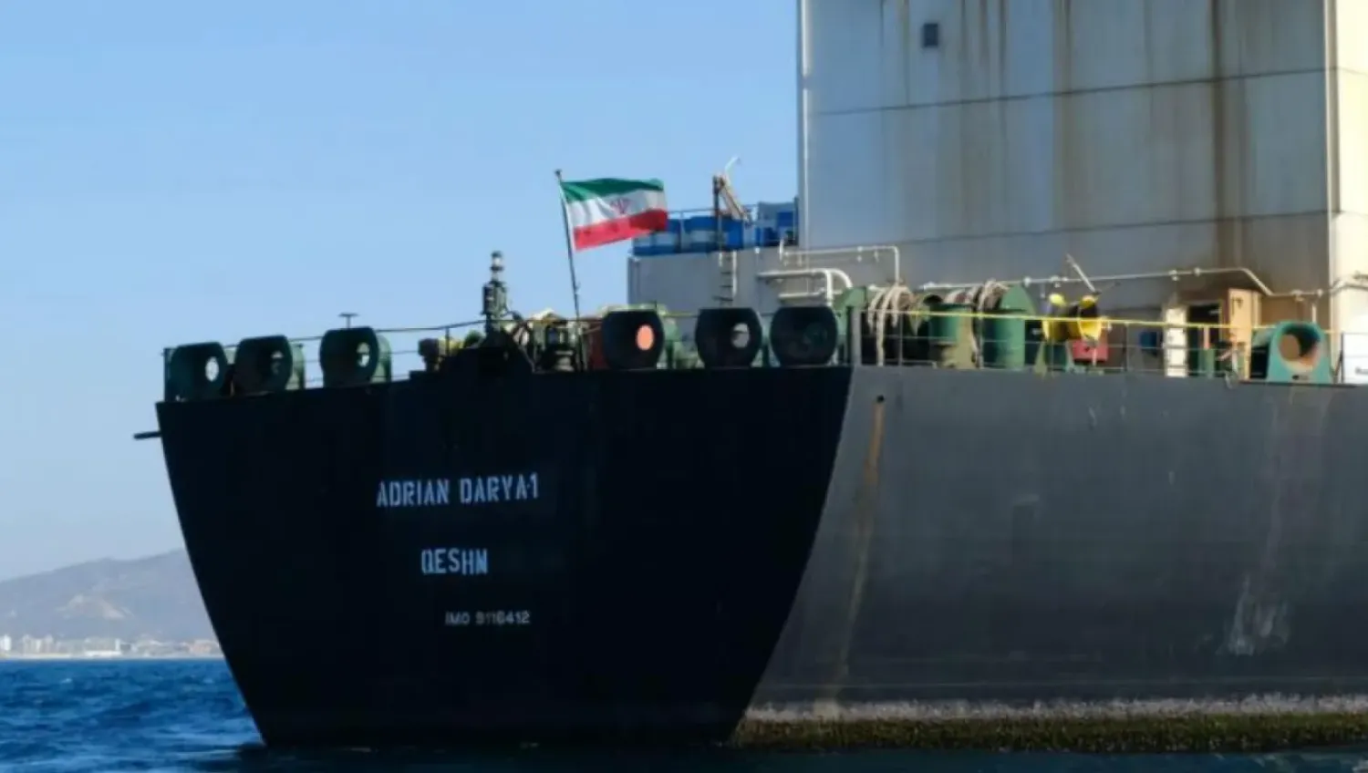 In this photo taken on August 18, 2019, an Iranian flag flutters on board an oil tanker that entered Syria’s Baniyas Port. (AFP File Photo)

