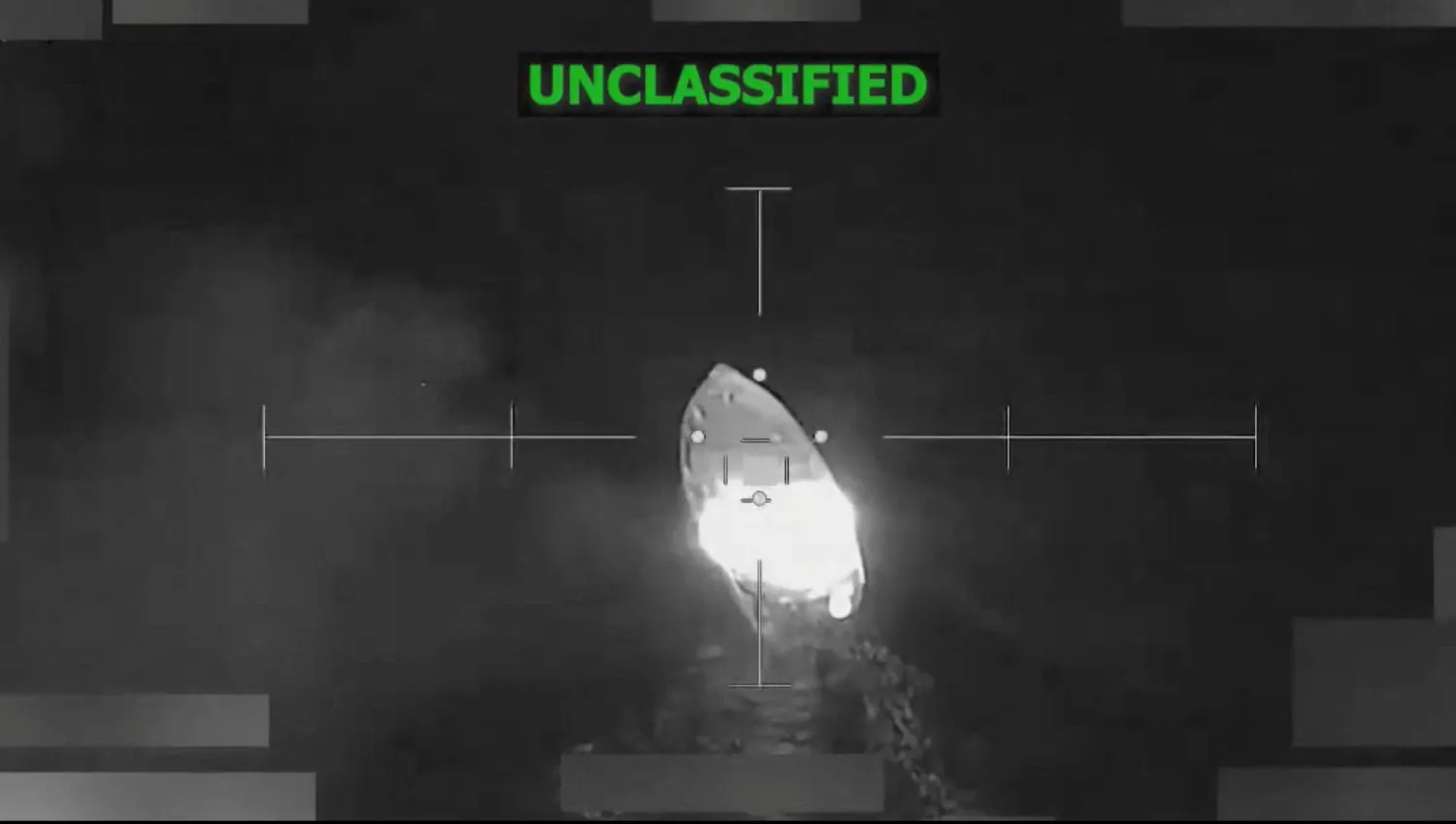 A vessel that the US military said was suspected of smuggling drugs, burns after being struck with a kinetic weapon in a location given as the Eastern Pacific, in this screengrab taken from a handout video released December 18, 2025. US Southern Command/Handout via REUTERS