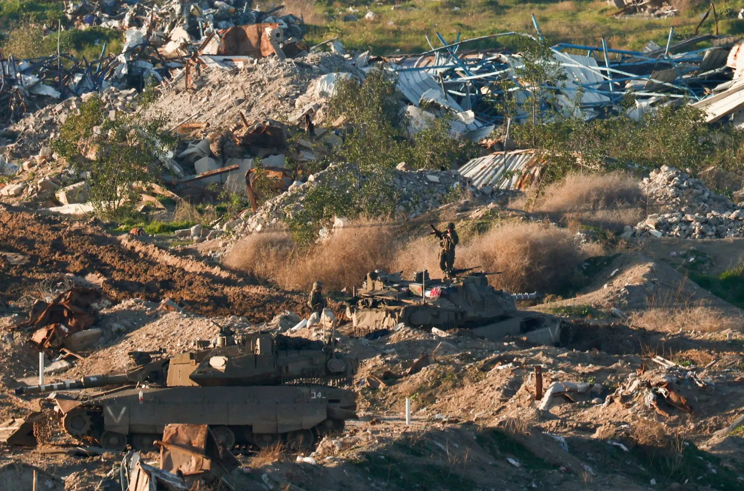 Israeli soldiers and tanks stand in Gaza, as seen from the Israeli side of the Israel-Gaza border, in Israel, February 4, 2026. REUTERS/Amir Cohen