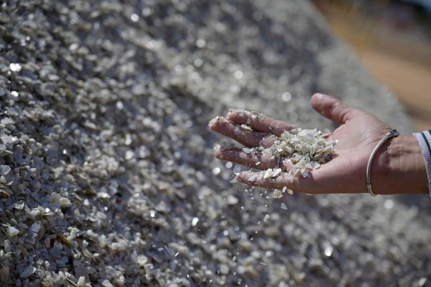 A worker collects samples at a mine in Brazil (Reuters)