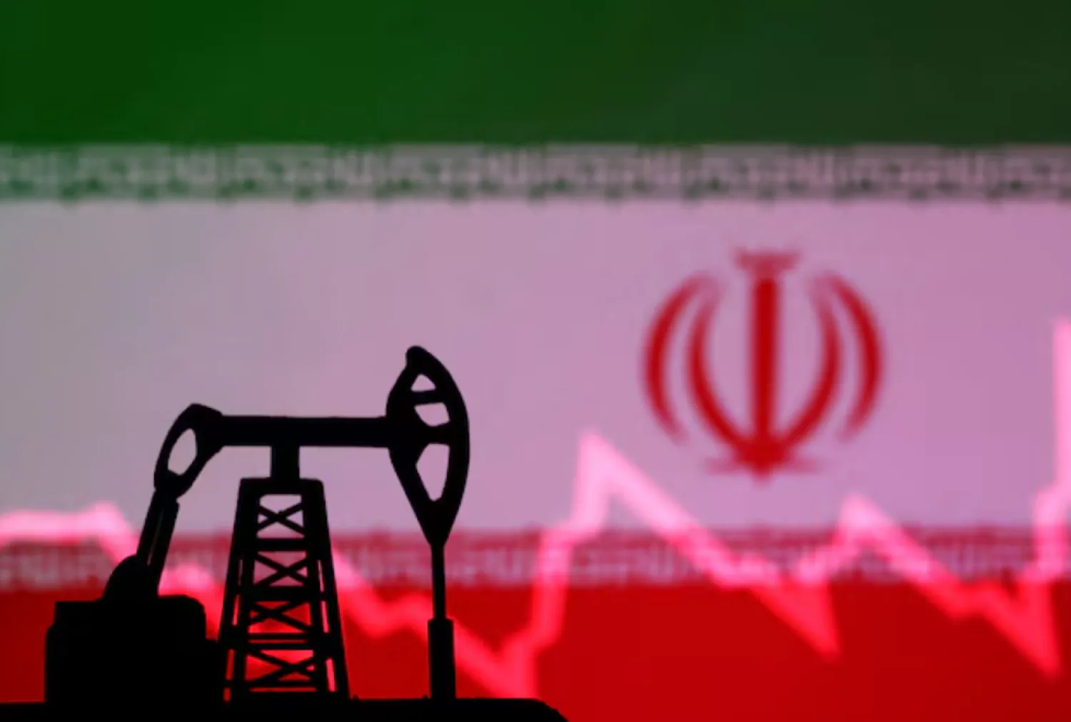 Iranian flag with stock graph and an oil pump jack miniature model are seen in this illustration taken October 9, 2023. REUTERS/Dado Ruvic/Illustration/File Photo 