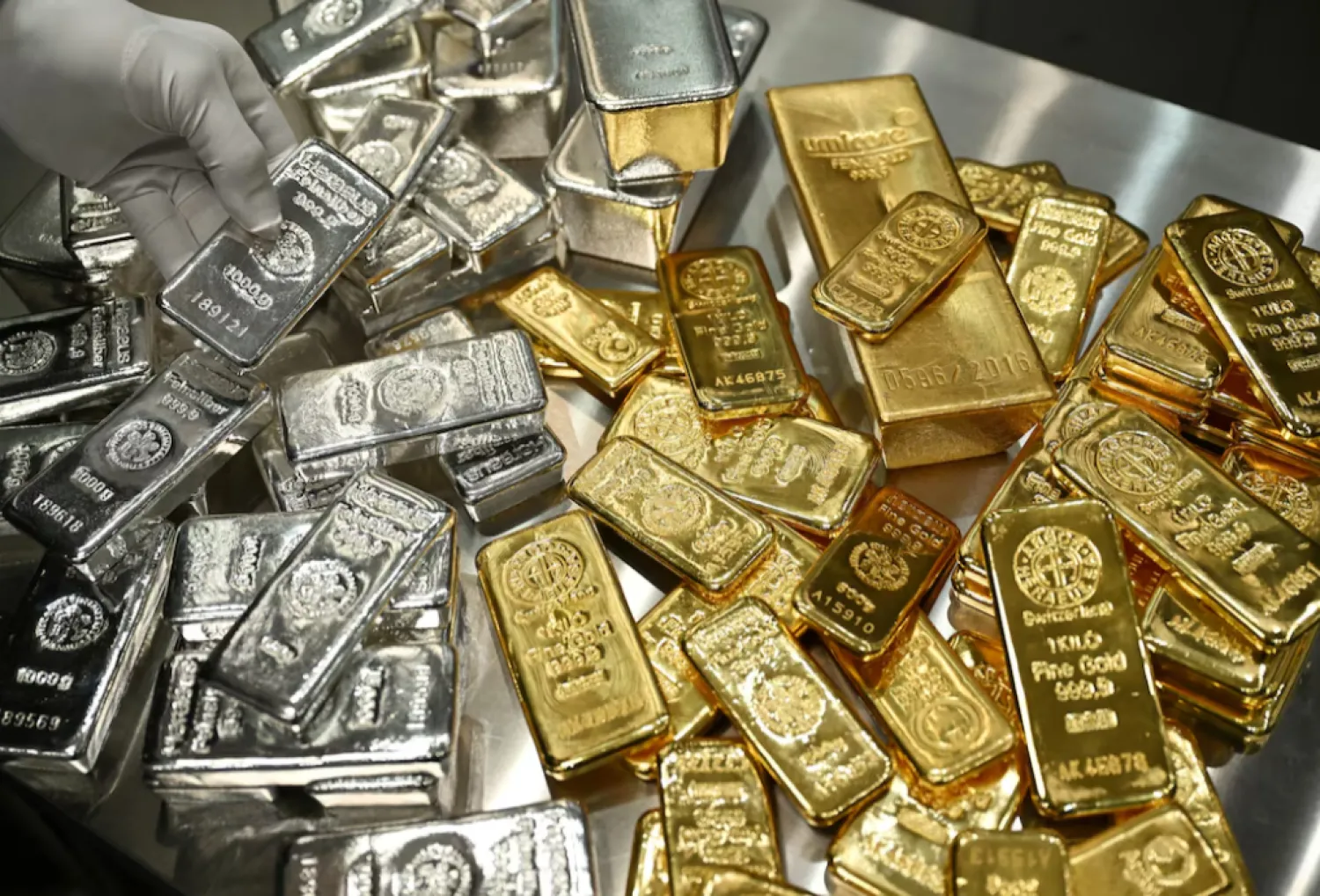 Gold and silver bars are stacked in the safe deposit boxes room of the Pro Aurum gold house in Munich, Germany, January 10, 2025. REUTERS/Angelika Warmuth 
