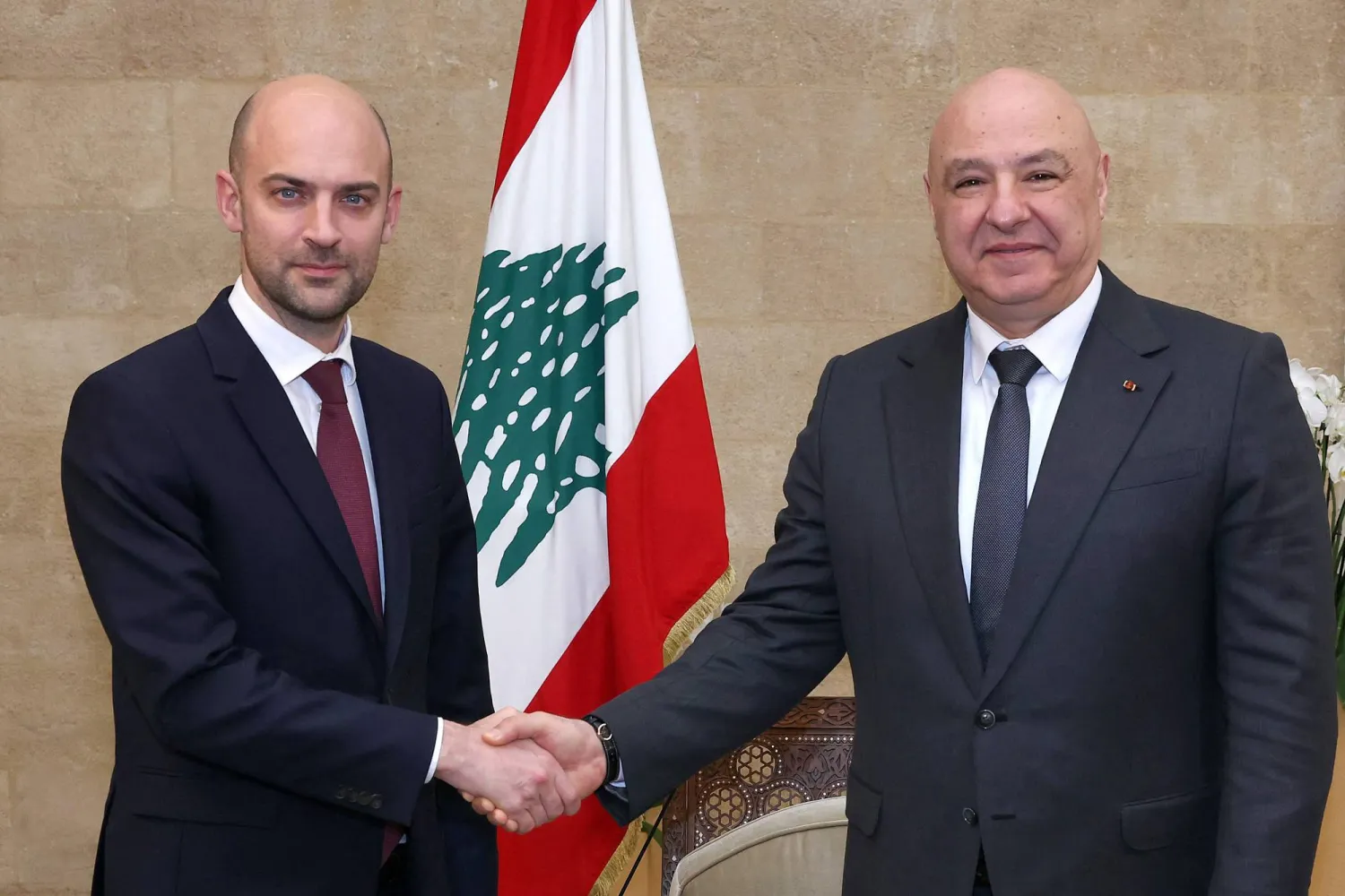 This handout photograph released by the Lebanese Presidency Press Office shows Lebanon's President Joseph Aoun (R) receiving France's Minister for Europe and Foreign Affairs Jean-Noel Barrot (L) at the Presidential Palace in Baabda, east of Beirut, on February 6, 2026. (Photo by Lebanese Presidency Press Office / AFP) 