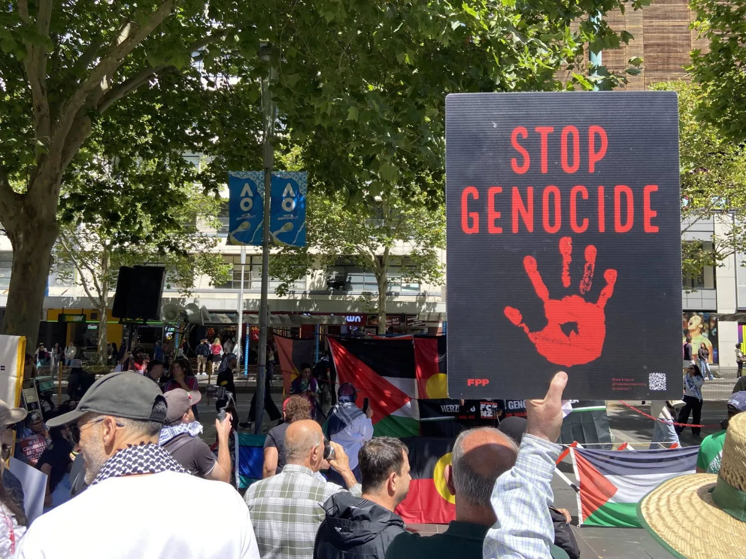  01 February 2026, Australia, Sydney: A protester holds a poster during a Free Palestine rally protesting the invitation of Isaac Herzog to Australia at the State Library of Victoria in Melbourne. (Jay Kogler/AAP/dpa)