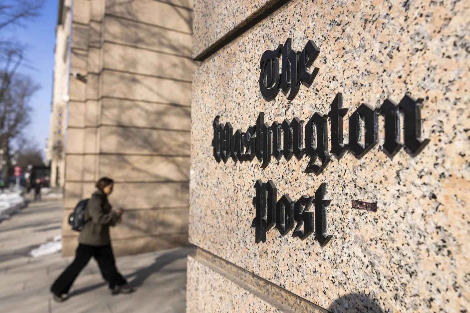 A person walks outside The Washington Post headquarters in Washington, DC, USA, 04 February 2026. EPA/JIM LO SCALZO
