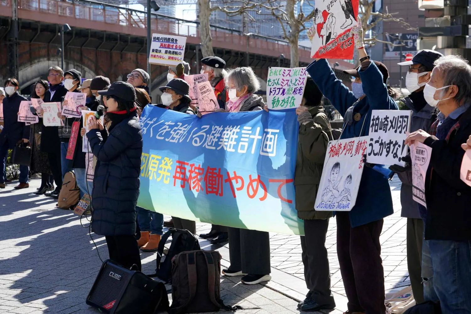 Participants demonstrate in front of Tokyo Electric Power Company's headquarters against the restart of the Kashiwazaki-Kariwa Nuclear Power Plant, in Tokyo on February 9, 2026. (Photo by Kazuhiro NOGI / AFP)