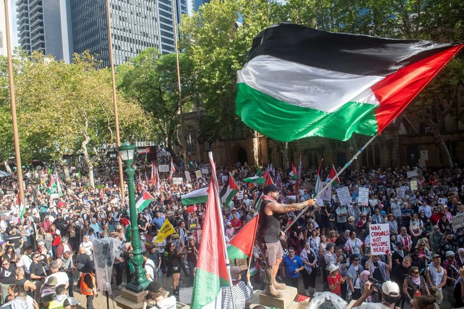  Demonstrators gather at Town Hall Square to protest against Israeli President Isaac Herzog's state visit to Australia following a deadly mass shooting during a Jewish Hanukkah celebration at Bondi Beach on December 14, 2025, in Sydney, Australia, February 9, 2026. (Reuters)