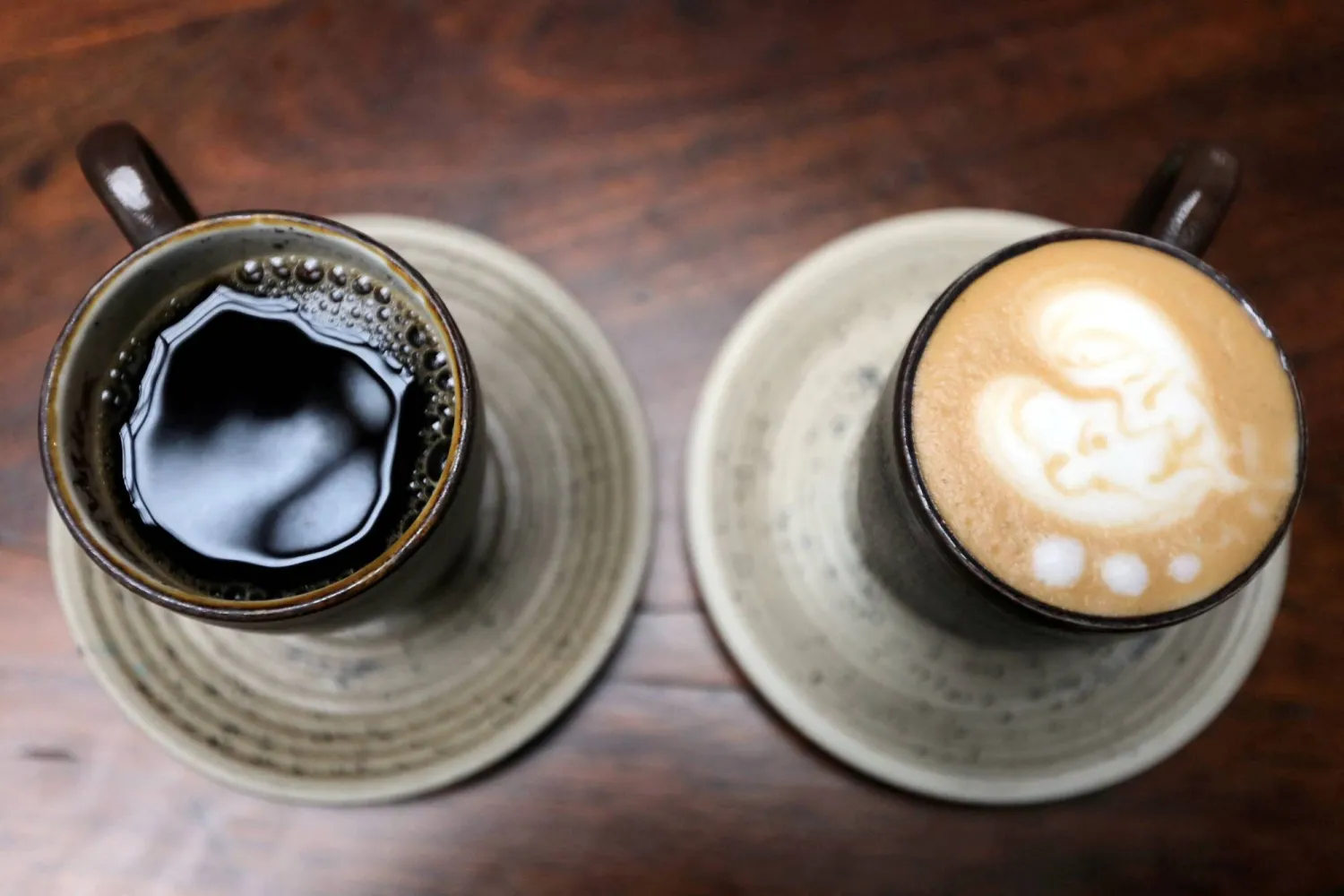 A cup of coffee and a cappuccino are seen at a Juan Valdez store in Bogota, Colombia June 5, 2019. (Reuters)