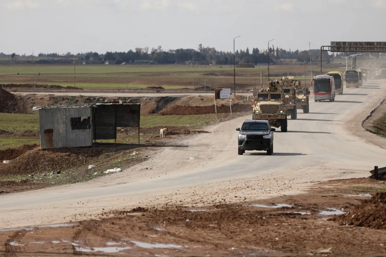 Vehicles transporting ISIS detainees by the US military, according to a security source from the Syrian Democratic Forces, head from Syria towards Iraq, in Qamishli, Syria, February 8, 2026. (Reuters)