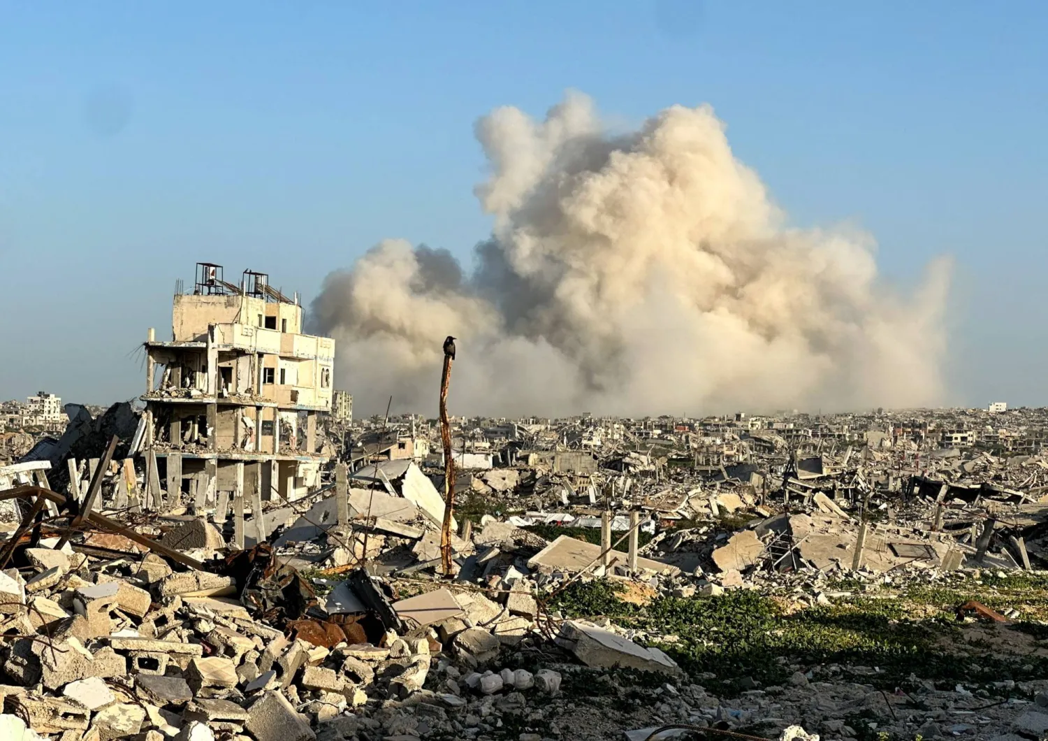  Smoke rises following an explosion, within the "yellow line" zone, which is controlled by Israel, in Khan Younis in the southern Gaza Strip, February 10, 2026. (Reuters)