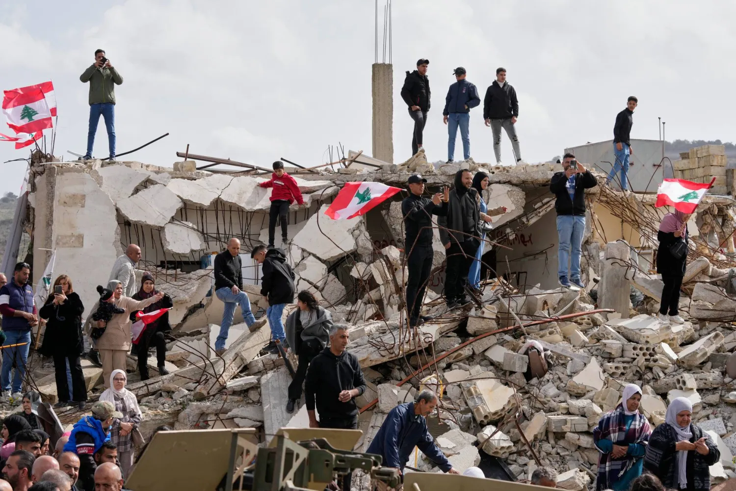 People gather as Lebanese Prime Minister Nawaf Salam tours areas in southern Lebanon, seen here in the village of Yarine, Saturday, Feb. 7, 2026. (AP) 