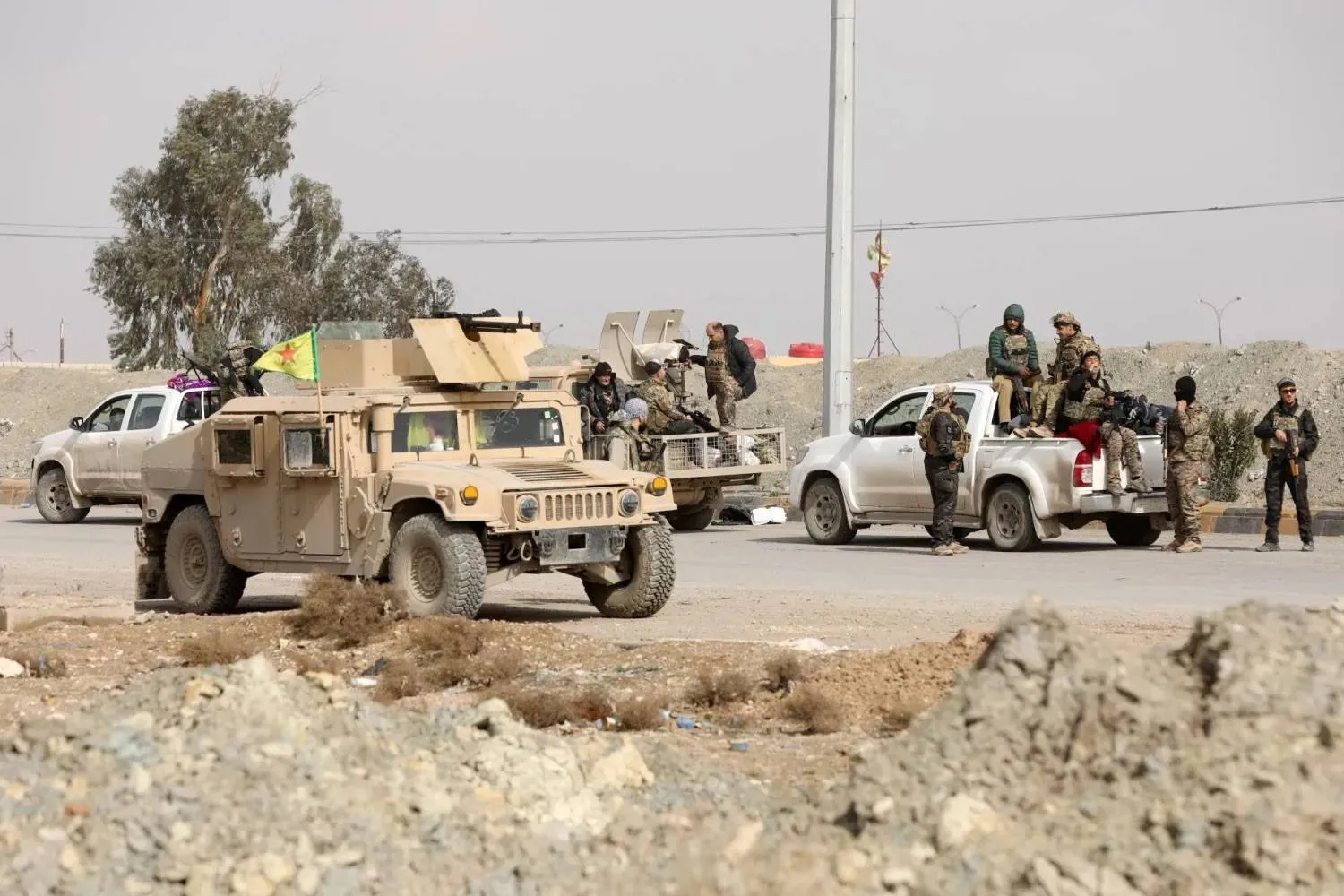 Members of the SDF in Hasakah, northeastern Syria, on Tuesday during their withdrawal from frontline positions under an agreement with the Syrian government. (Reuters) 