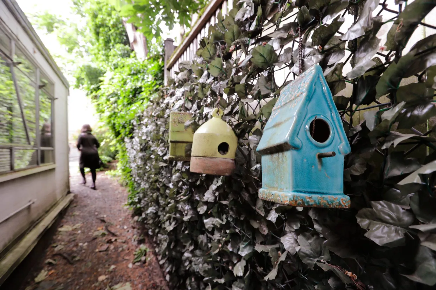 FILE - Birdhouses line a path outside a resident's room at the Ida Culver House Ravenna, a senior independent and assisted living home in Seattle, on May 21, 2020. (AP Photo/Elaine Thompson, File)