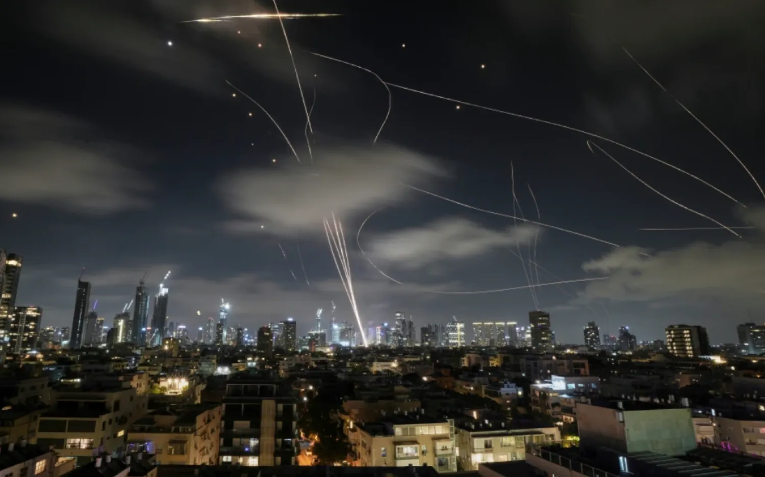 The Israeli Iron Dome air defense system intercepts missiles during an Iranian attack on Tel Aviv, Israel, June 18, 2025. (AP Photo/Leo Correa, File)

