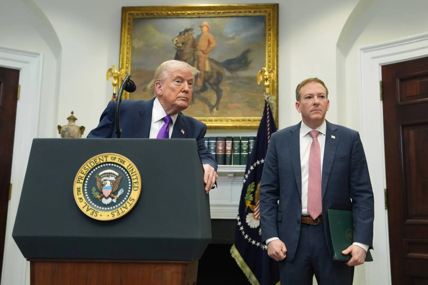 President Donald Trump listens to a question from a reporter during an event with Environmental Protection Agency director Lee Zeldin to announce the EPA will no longer regulate greenhouse gases, in the Roosevelt Room of the White House, Thursday, Feb. 12, 2026, in Washington. (AP Photo/Evan Vucci)