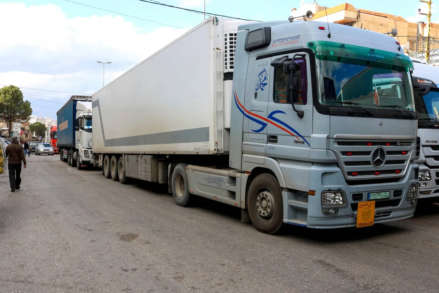 Lebanese truck drivers block the road on the Lebanese side of the Masnaa border crossing in protest against Syria's decision to ban non-Syrian trucks from entering its territory, on February 10, 2025. (Photo by Hassan JARRAH / AFP)
