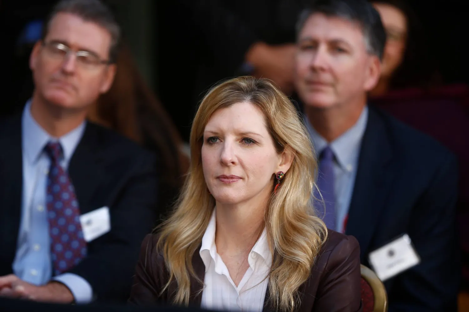 FILE - White House counsel Kathryn Ruemmler listens as President Barack Obama speaks at an installation ceremony for FBI Director James Comey at FBI Headquarters, in Washington, Oct. 28, 2013. Charles Dharapak/AP