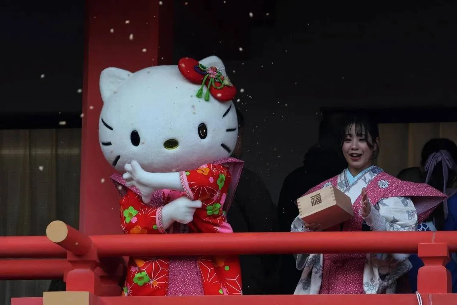 A participant dressed as Hello Kitty throws beans during the annual Setsubun ceremony to celebrate the upcoming arrival of spring. (Reuters)