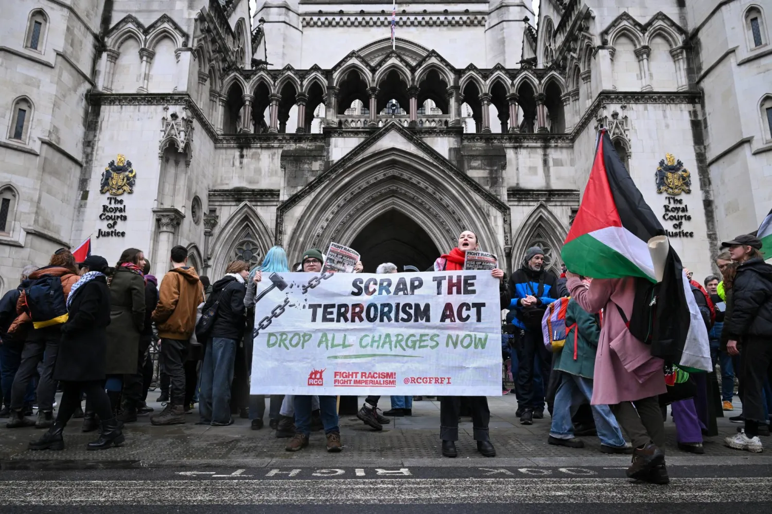 People protest outside the High Court as judges prepare to rule on a legal challenge to the British government’s decision to designate pro‑Palestinian group Palestine Action as a terrorist organisation, in London, Britain, February 13, 2026. REUTERS/Jaimi Joy