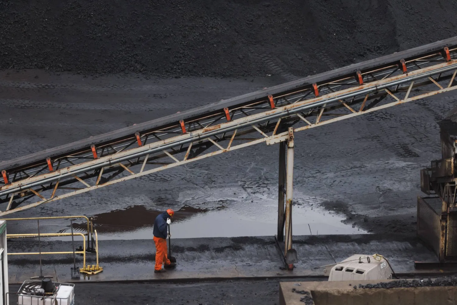 A worker in the coal fields at US Steel's Clairton Coke Works in Clairton, Pa., on Wednesday, Nov. 19, 2025. (Quinn Glabicki/Pittsburgh's Public Source via AP)