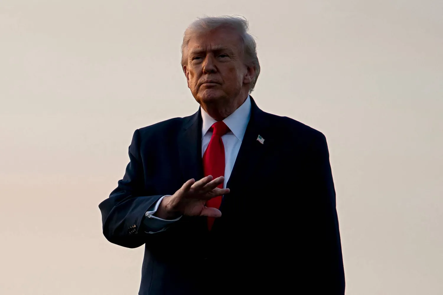 WEST PALM BEACH, FLORIDA - FEBRUARY 13: US President Donald Trump gestures to members of the media after exiting Air Force One at Palm Beach International Airport on February 13, 2026 in West Palm Beach, Florida. Nathan Howard/Getty Images/AFP