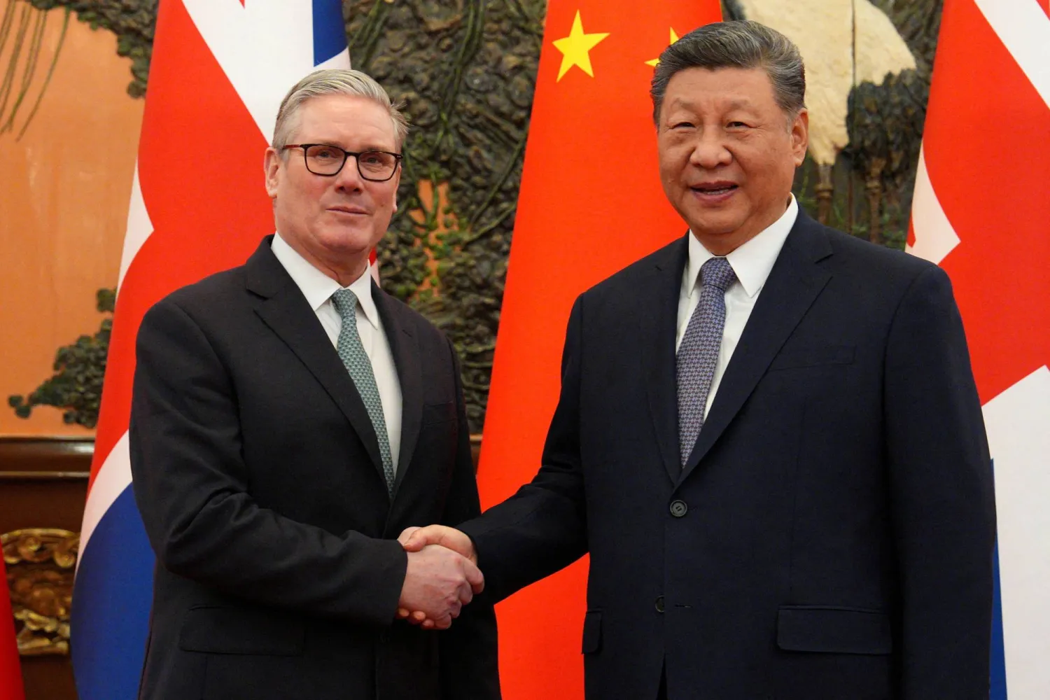 Britain's Prime Minister Keir Starmer shakes hands with Chinese President Xi Jinping, ahead of a bilateral meeting in Beijing, China, January 29, 2026. Carl Court/Pool via REUTERS 