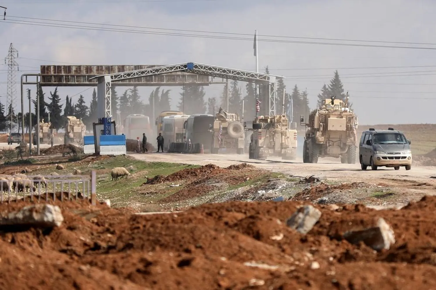 US military vehicles escort buses transporting ISIS detainees from Syria to Iraq, according to a security source from the Syrian Democratic Forces, in Qamishli, Syria, February 8, 2026. (Reuters) 