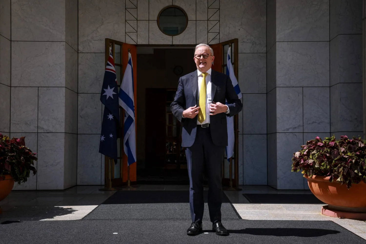 Australia's Prime Minister Anthony Albanese stands outside the entrance to his office at Parliament House in Canberra on February 11, 2026. (AFP)