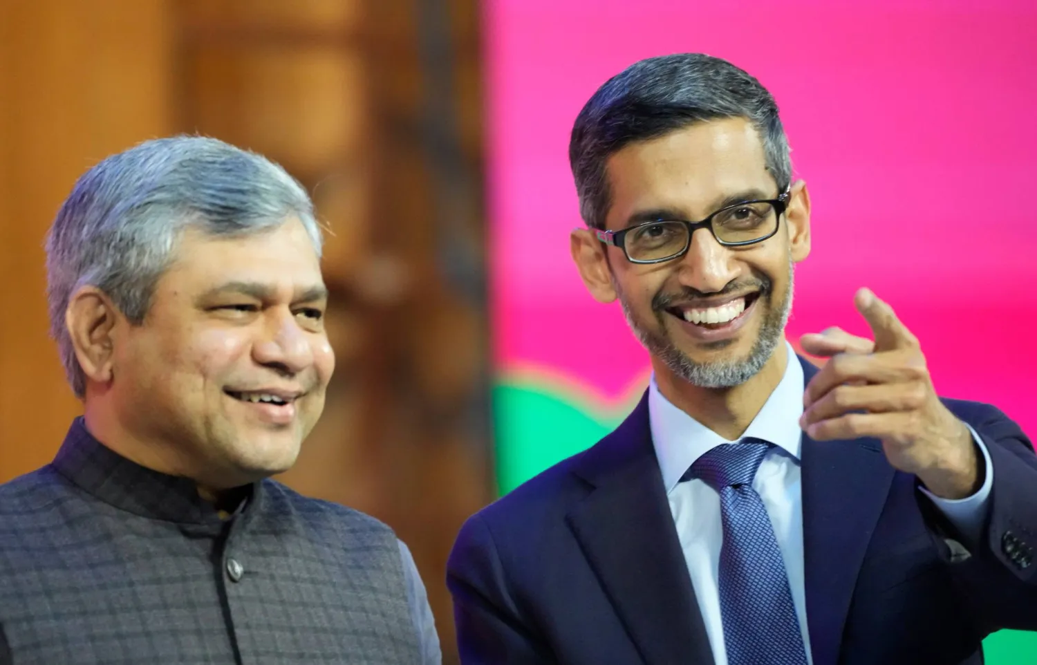 FILE -Google CEO Sundar Pichai, right, interacts with India's Minister for Information and Technology Ashwini Vaishnaw during Google for India 2022 event in New Delhi, Dec. 19, 2022. (AP Photo/Manish Swarup), File)