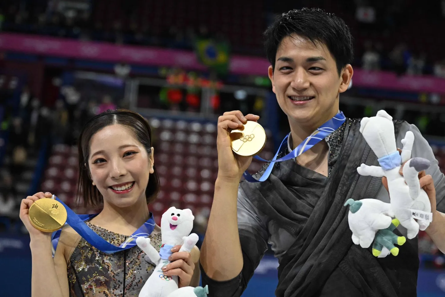 Gold medalists Japan's Riku Miura and Japan's Ryuichi Kihara pose after the figure skating pair skating free skating final during the Milano Cortina 2026 Winter Olympic Games at Milano Ice Skating Arena in Milan on February 16, 2026. (AFP)