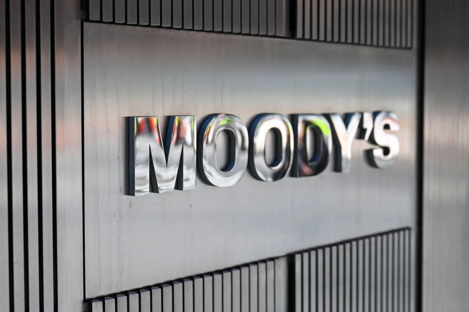 (FILES) Signage for Moody's Corporation is displayed at their headquarters at 7 World Trade Center on March 18, 2025 in New York City. (Photo by ANGELA WEISS / AFP)