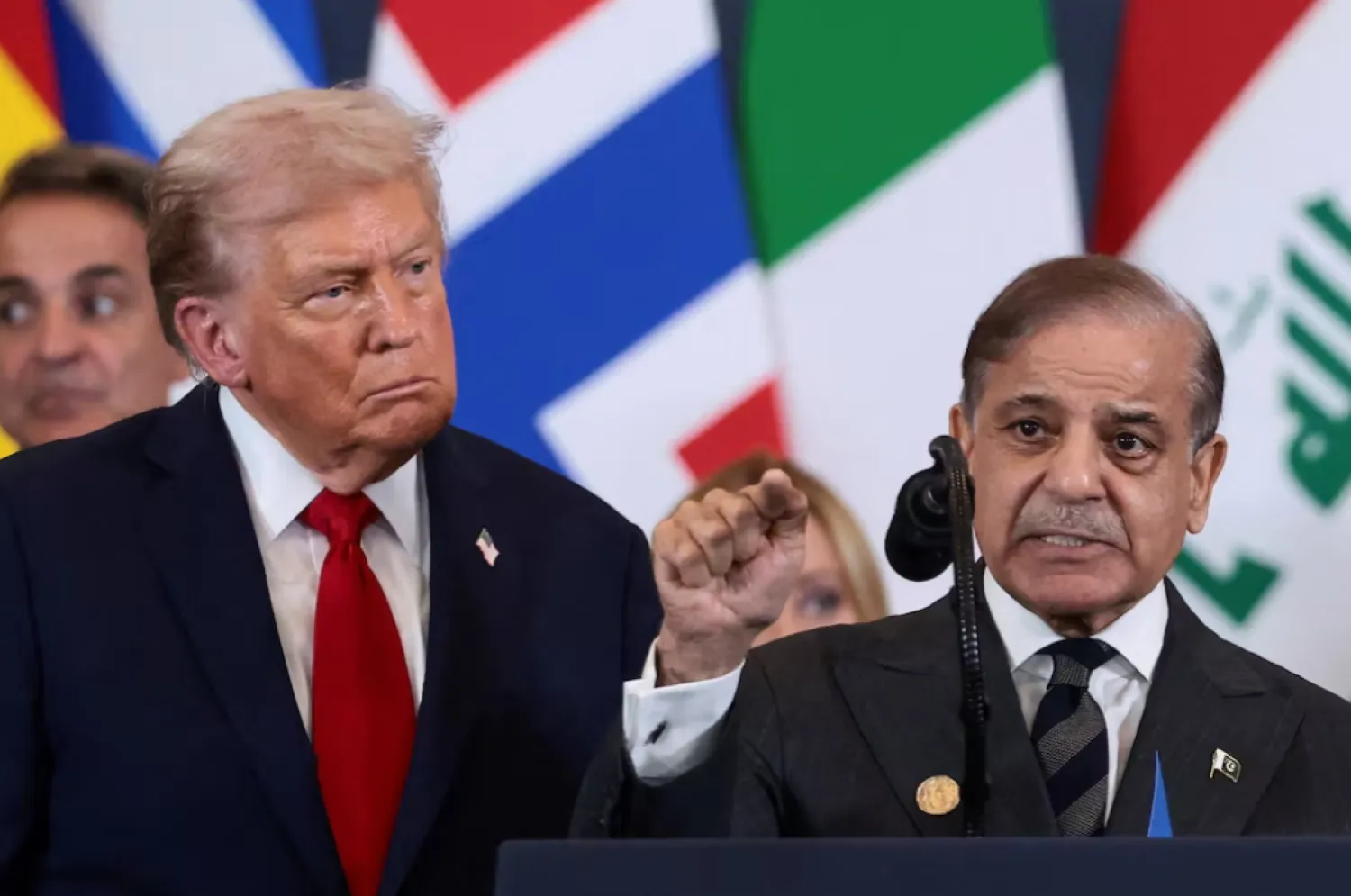 US President Donald Trump looks at Pakistan's Prime Minister Shehbaz Sharif speaking following the official signing of the first phase of the Gaza ceasefire agreement between Israel and Hamas, during a world leaders' summit on ending the Gaza war, in Sharm El-Sheikh, Egypt, October 13, 2025. REUTERS/Evelyn Hockstein/File Photo 