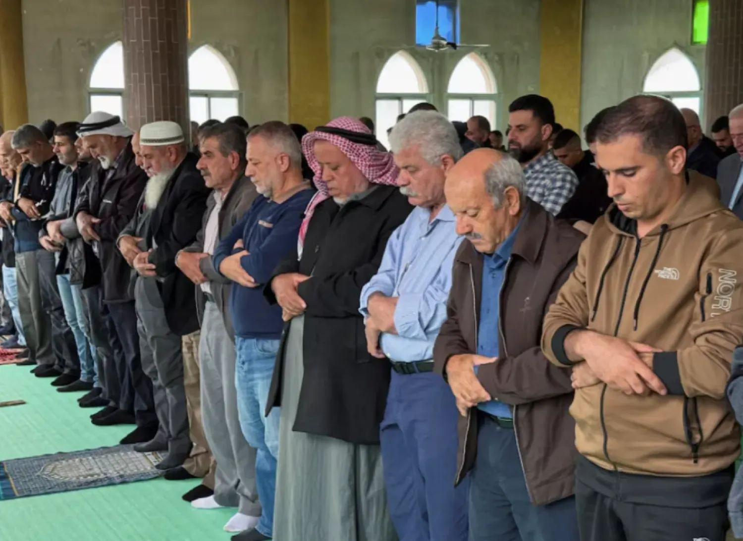 Palestinians attend Friday prayers in a mosque following an attack that local Palestinians said was carried out by Israeli settlers, in the village of Deir Istiya near Salfit in the Israeli-occupied West Bank November 14, 2025. REUTERS/Sinan Abu Mayzer
