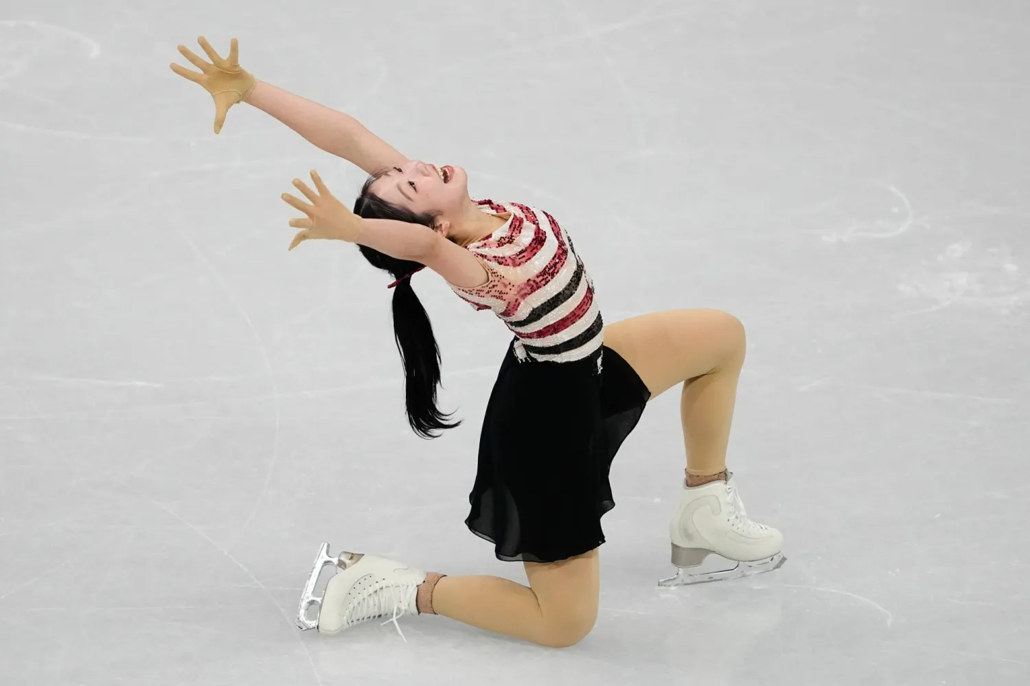 Ami Nakai of Japan competes during the women's short program figure skating at the 2026 Winter Olympics, in Milan, Italy, Tuesday, Feb. 17, 2026. (AP Photo/Ashley Landis)
