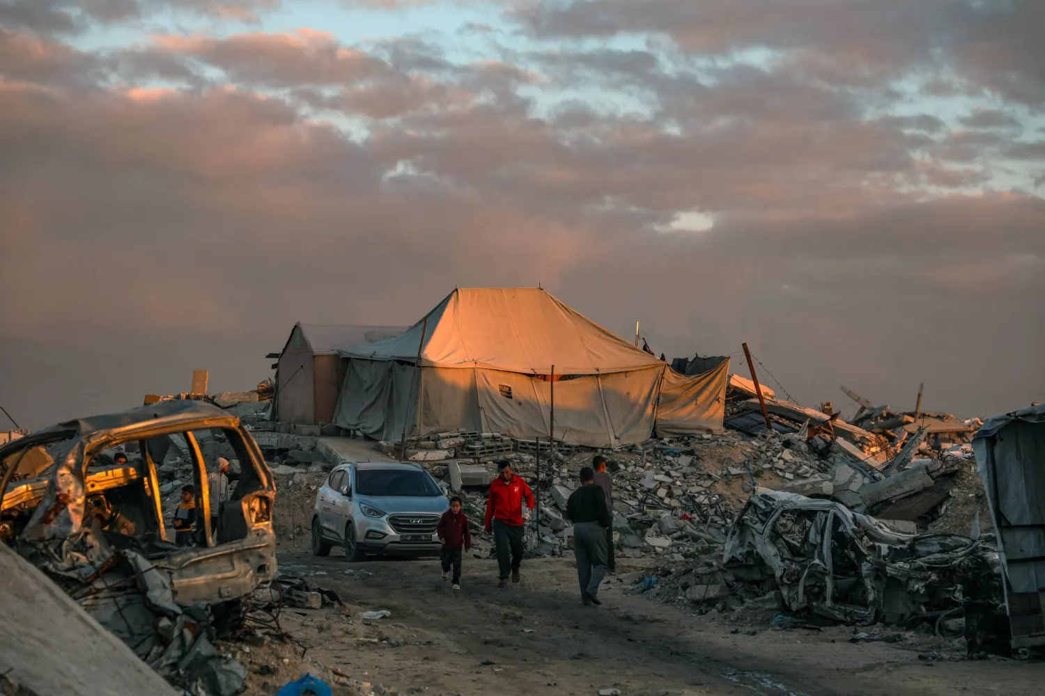 Makeshift tents of displaced Palestinian families among the ruins of their homes at sunset during the holy month of Ramadan in Jabaliya northern Gaza Strip on, 19 February 2026. (EPA)