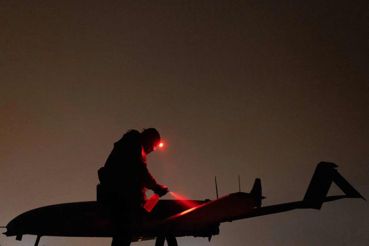 FILE PHOTO: A Ukrainian service member of the 14th Unmanned Aerial Systems Regiment prepares a deep strike unmanned aerial vehicle before its launch toward Russian territory, amid Russia's attack on Ukraine, in an undisclosed location in Ukraine, undisclosed date, 2025. REUTERS/Valentyn Ogirenko/File Photo
