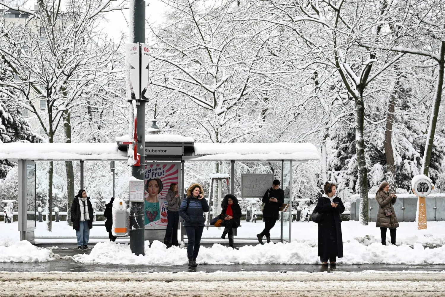 People wait at a tram stop after heavy snowfalls in Vienna, Austria, February 20, 2026. REUTERS/Elisabeth Mandl