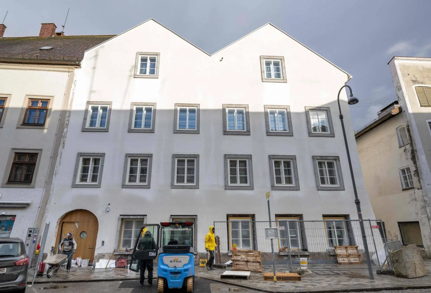 Workers are finishing works at the birth house of former German dictator Adolf Hitler that is turned into a police station, pictured on February 17, 2026 in Braunau am Inn, Austria. (AFP)