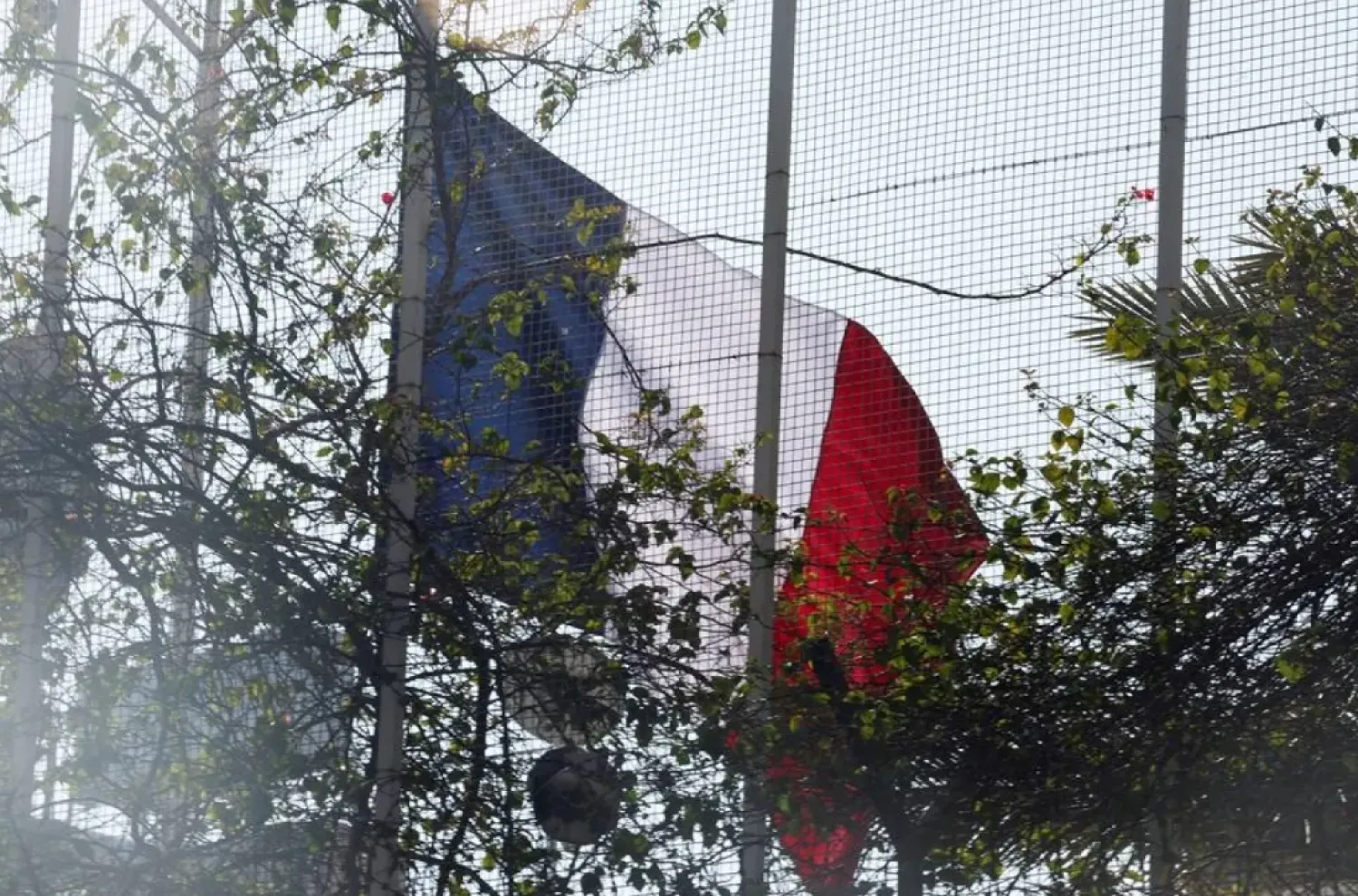 The French national flag is raised at a French embassy, December 17, 2024. (Reuters)
