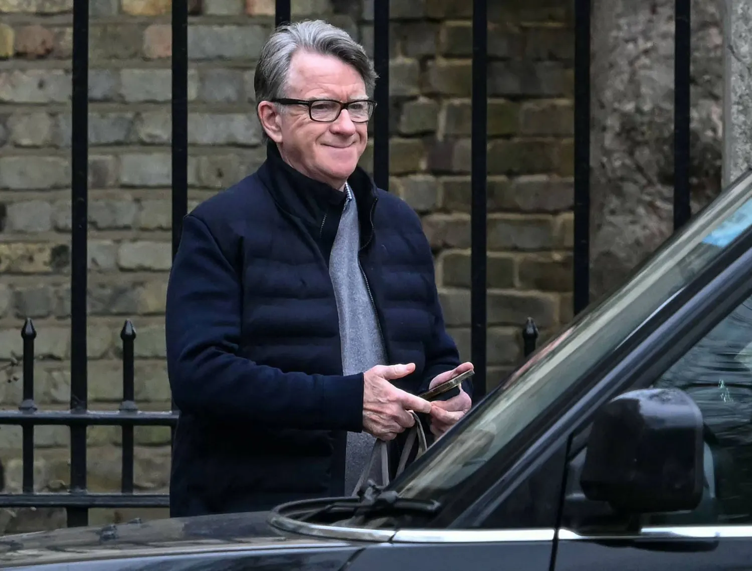 Former UK ambassador to the United States, Peter Mandelson, is pictured as he leaves his residence in central London on February 21, 2026. (AFP)