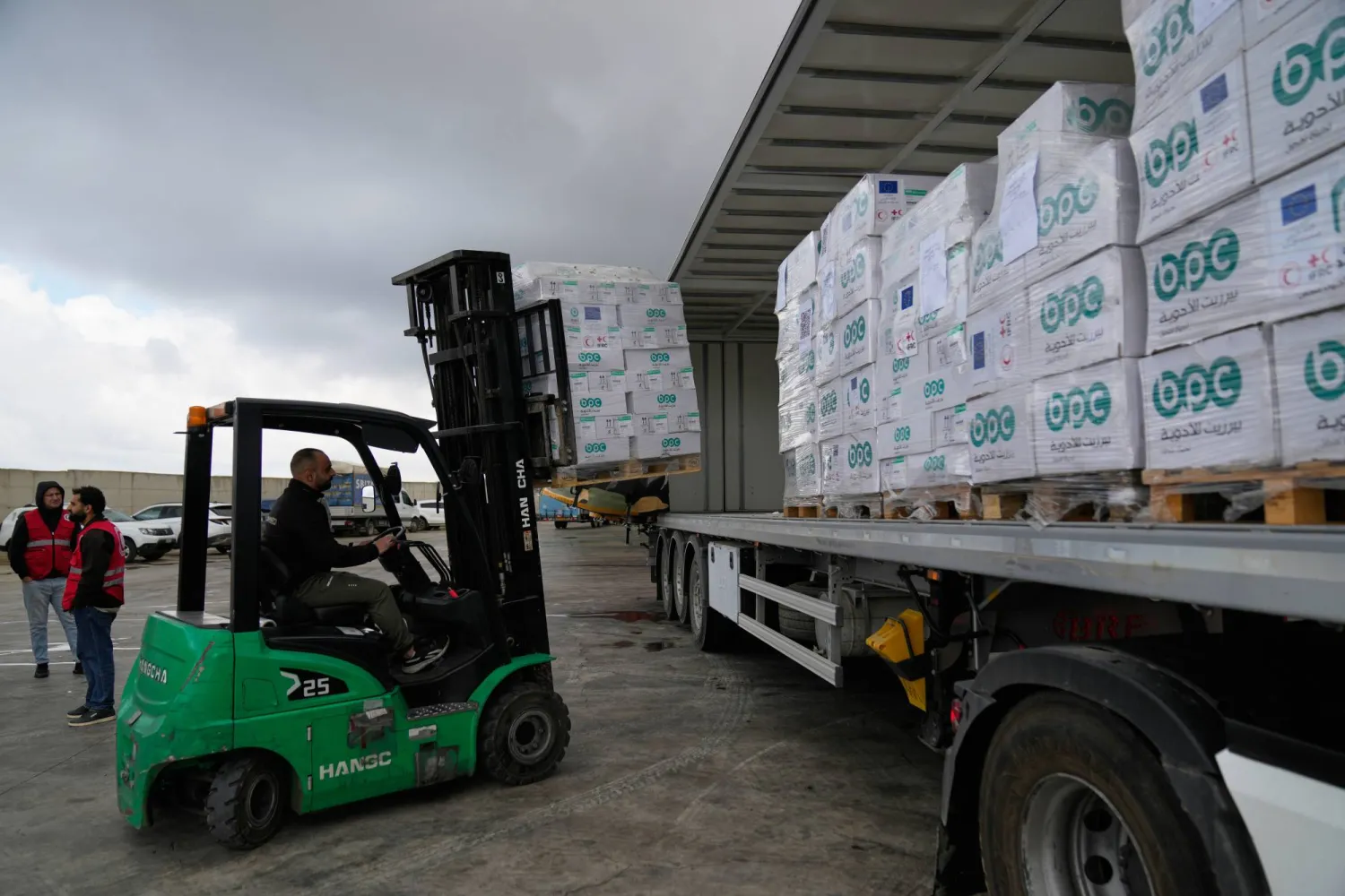 Palestinian Red Crescent workers load medical supplies to be transported to Gaza, at the launch of a joint logistical operation with the European Union and the Red Cross, in the West Bank city of Beitunia, Tuesday, Feb. 24, 2026. (AP)