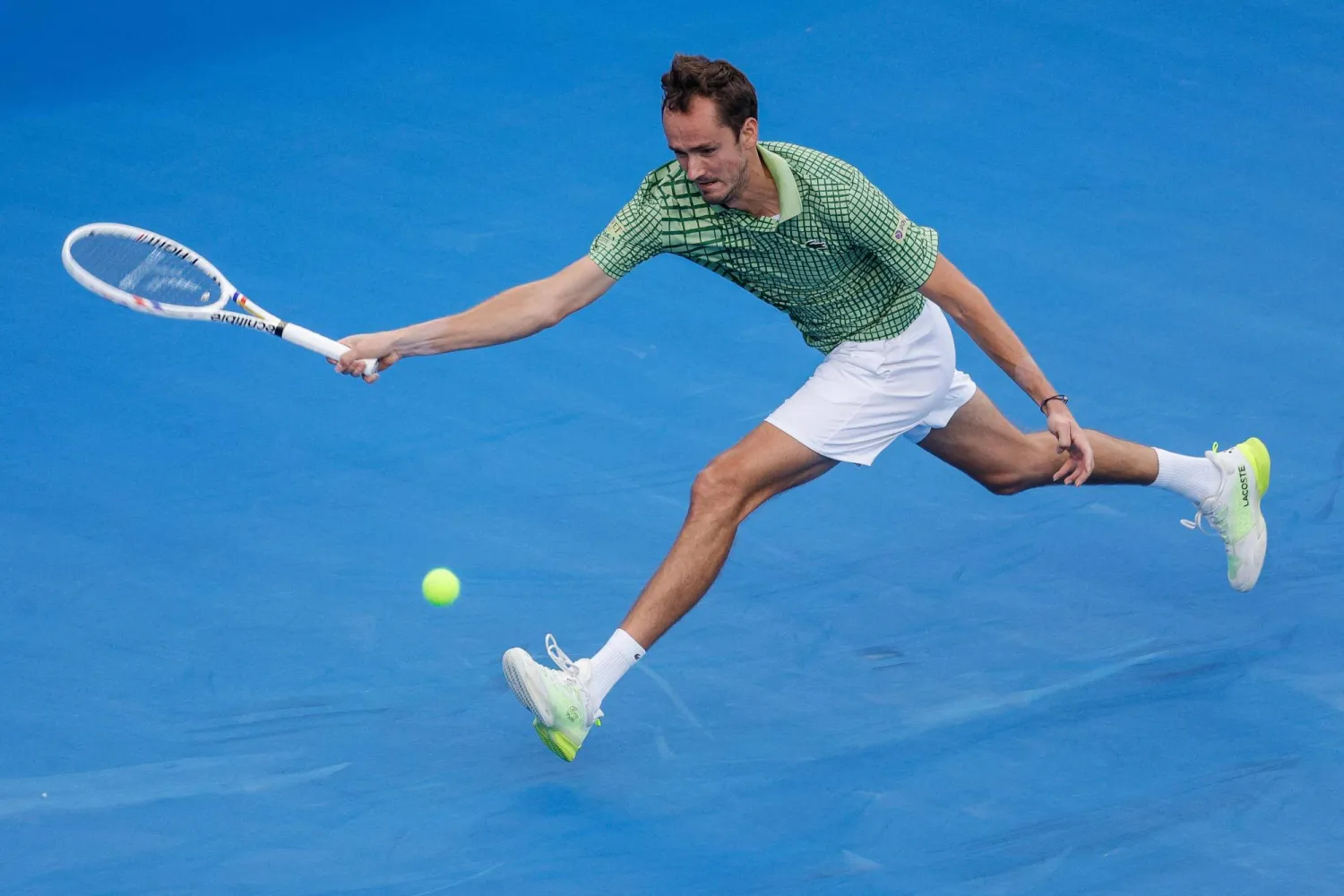 Russia's Daniil Medvedev hits a return against Greece's Stefanos Tsitsipas during their men's singles match at the Qatar Open tennis tournament in Doha on February 18, 2026. (AFP)