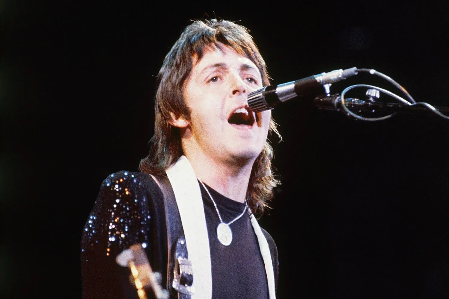 Paul McCartney, of Paul McCartney and Wings, performs at the Nassau Coliseum in Uniondale, NY on May 21, 1976. (AP)