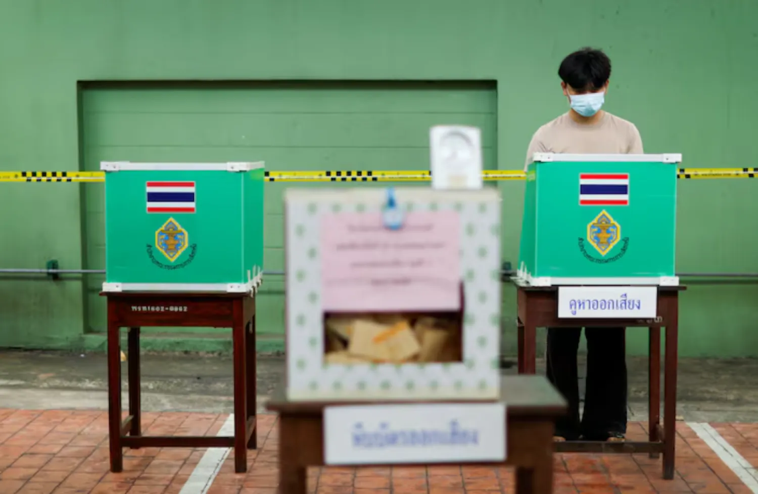 A person votes during the general elections at a polling station in Bangkok, Thailand, February 8, 2026. REUTERS/Patipat Janthong/File Photo 