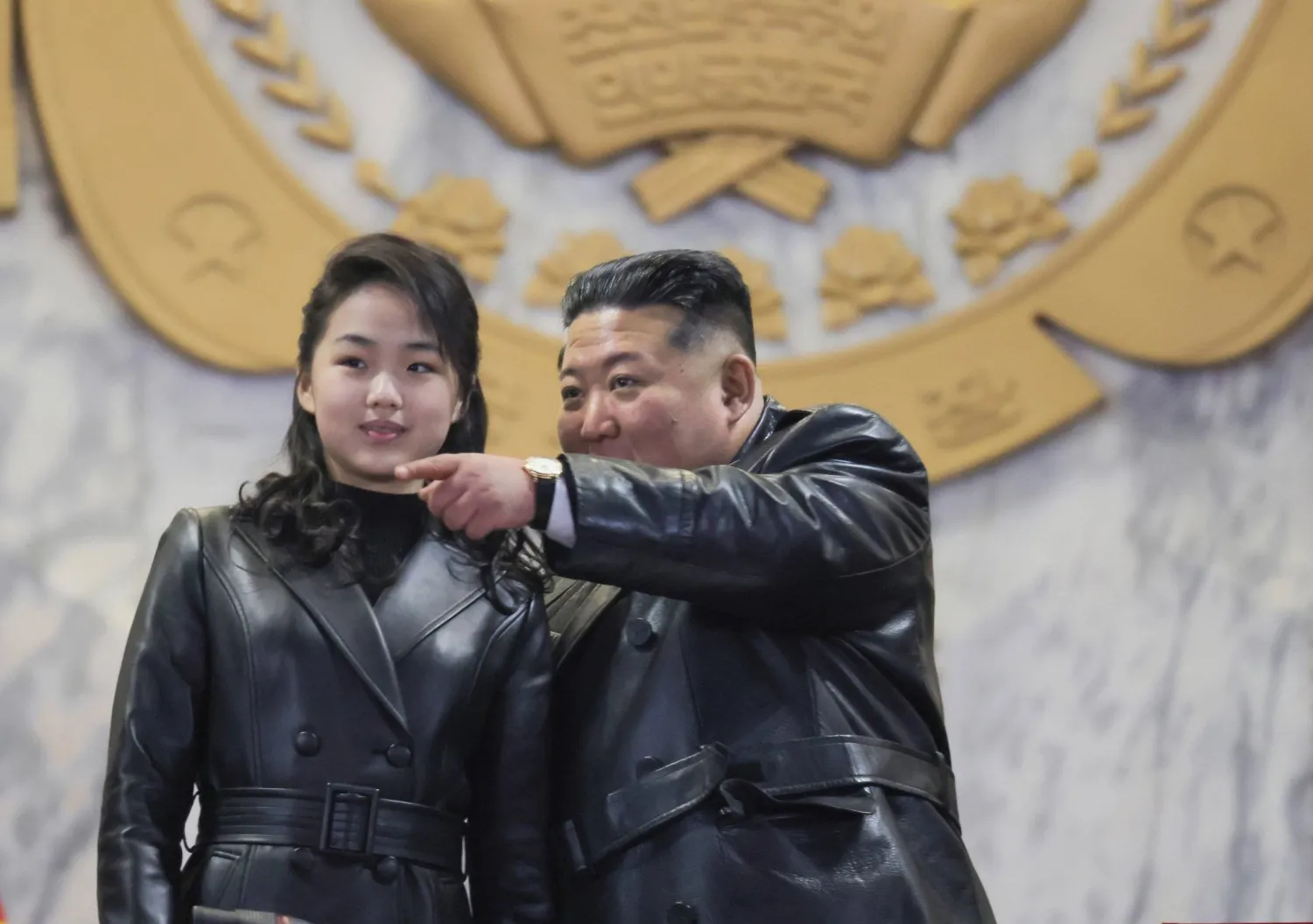 25 February 2026, North Korea, Pyongyang: North Korean leader Kim Jong-un (R), alongside his daughter, Ju-ae, attend a military parade at Kim Il Sung Square in Pyongyang, to mark the ninth congress of the ruling Workers' Party, in this photo released by Korean Central News Agency the next day. Photo: -/YNA/dpa