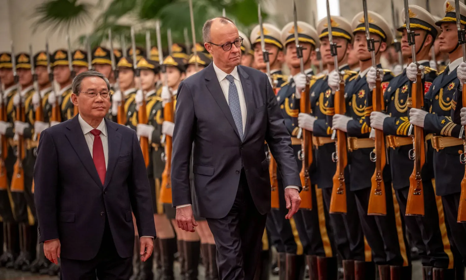 Chinese Premier Li Qiang welcomes German Chancellor Friedrich Merz with military honors in the Great Hall of the People in in Beijing, China, February 25, 2026. (Reuters)
