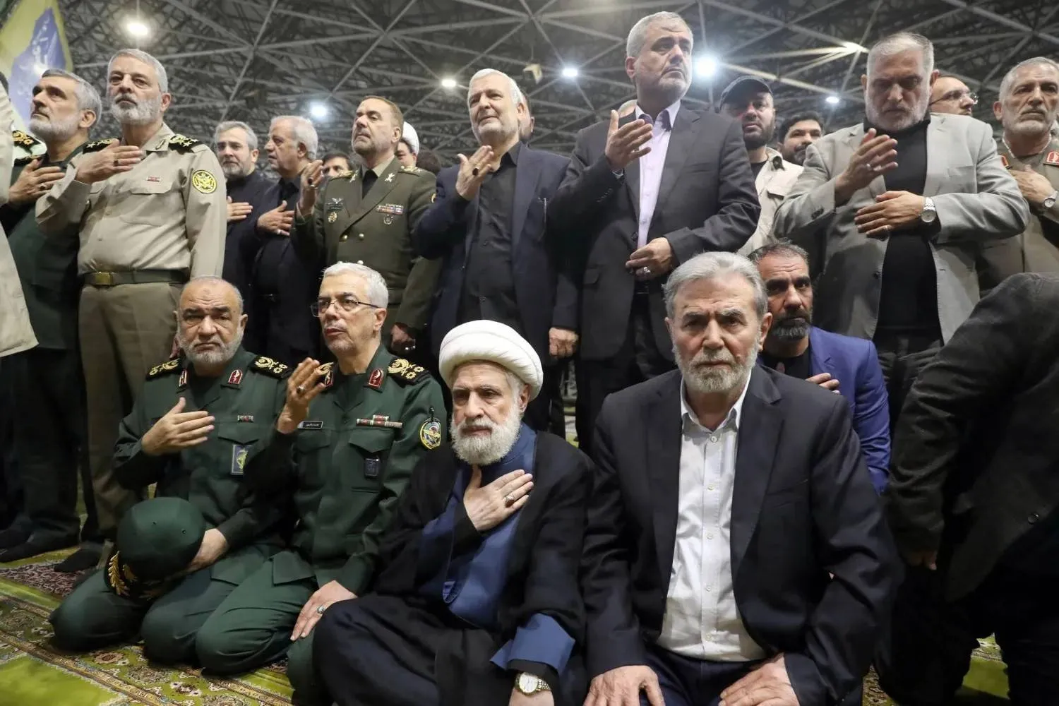 Ziyad al-Nakhalah, head of the Palestinian Islamic Jihad movement (seated right), alongside Naim Qassem, secretary-general of Lebanon’s Hezbollah, and senior Iranian military officials during the funeral of late Hamas leader Ismail Haniyeh in Tehran, August 2024 (Reuters)