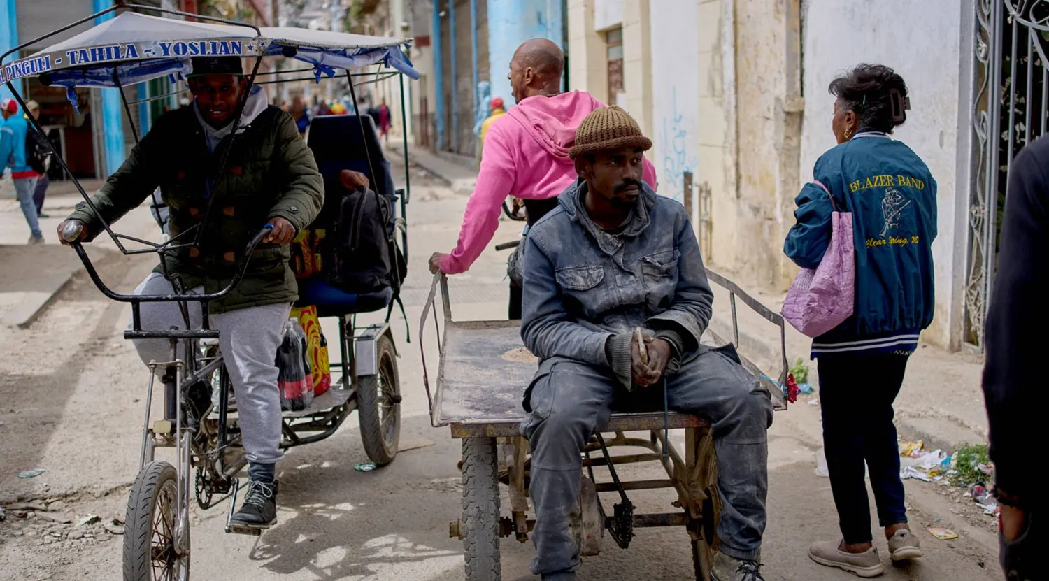 Cuba suffers from high levels of poverty... Pictured are people in a neighborhood of Havana on February 24 (AP)