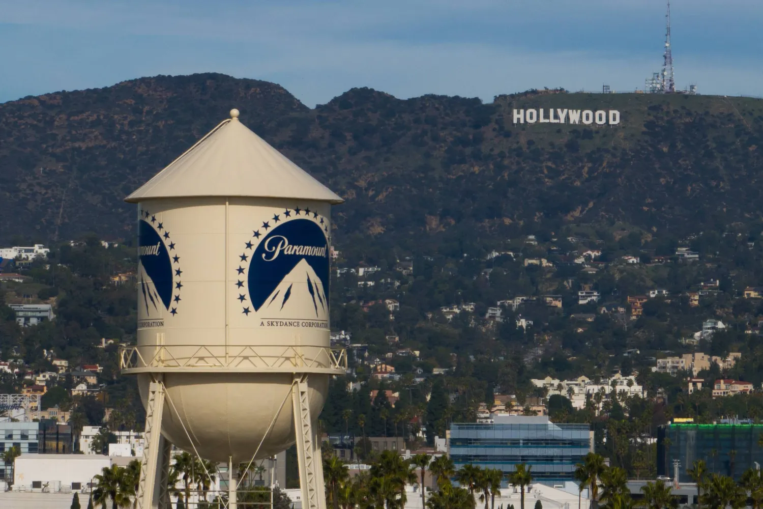 The Paramount Pictures water tower is seen in Los Angeles, Dec. 18, 2025, with the Hollywood sign in the distance. (AP)