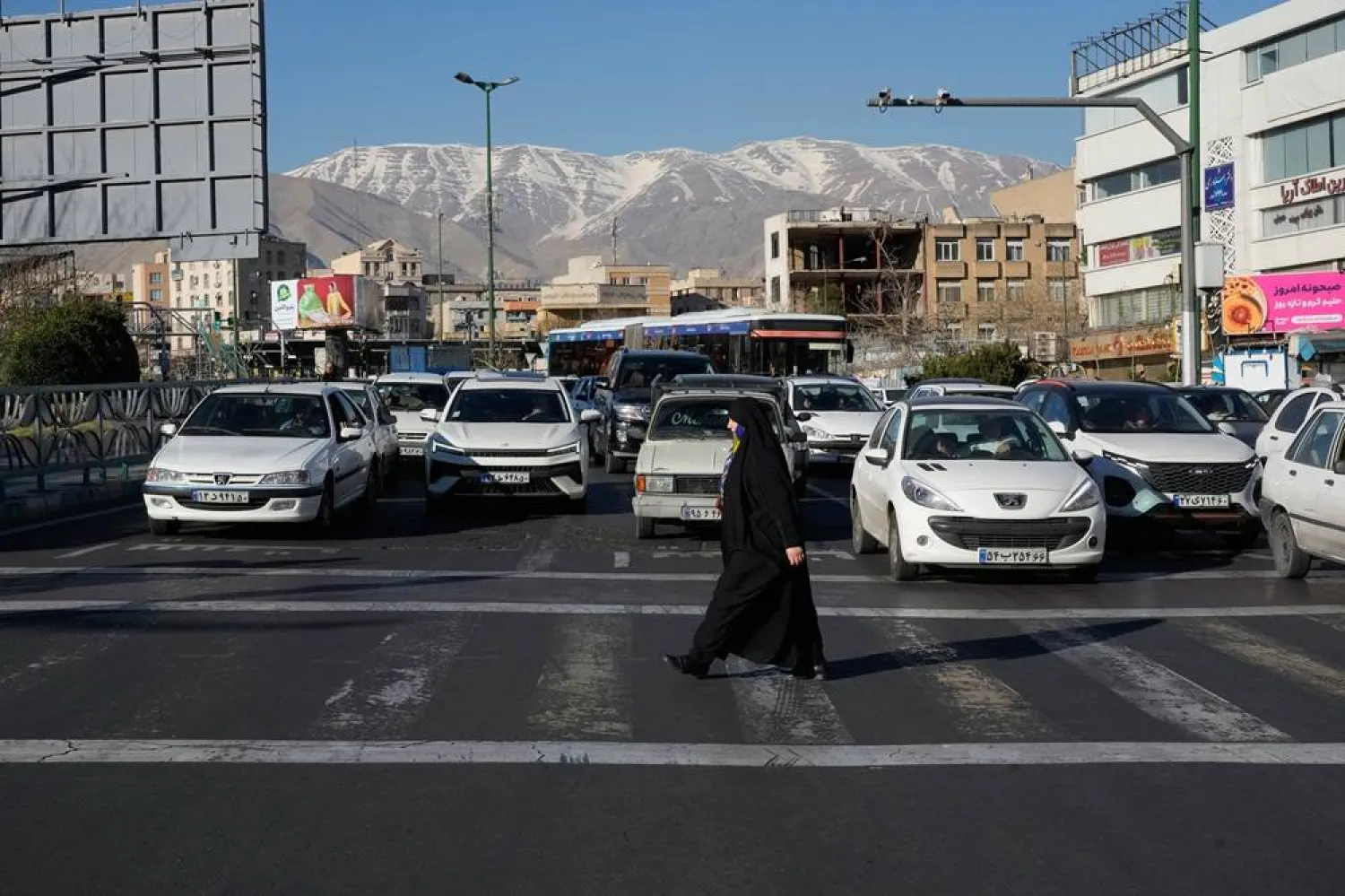  A woman crosses a street in Tehran, Iran, Thursday, Feb. 26, 2026. (AP) 